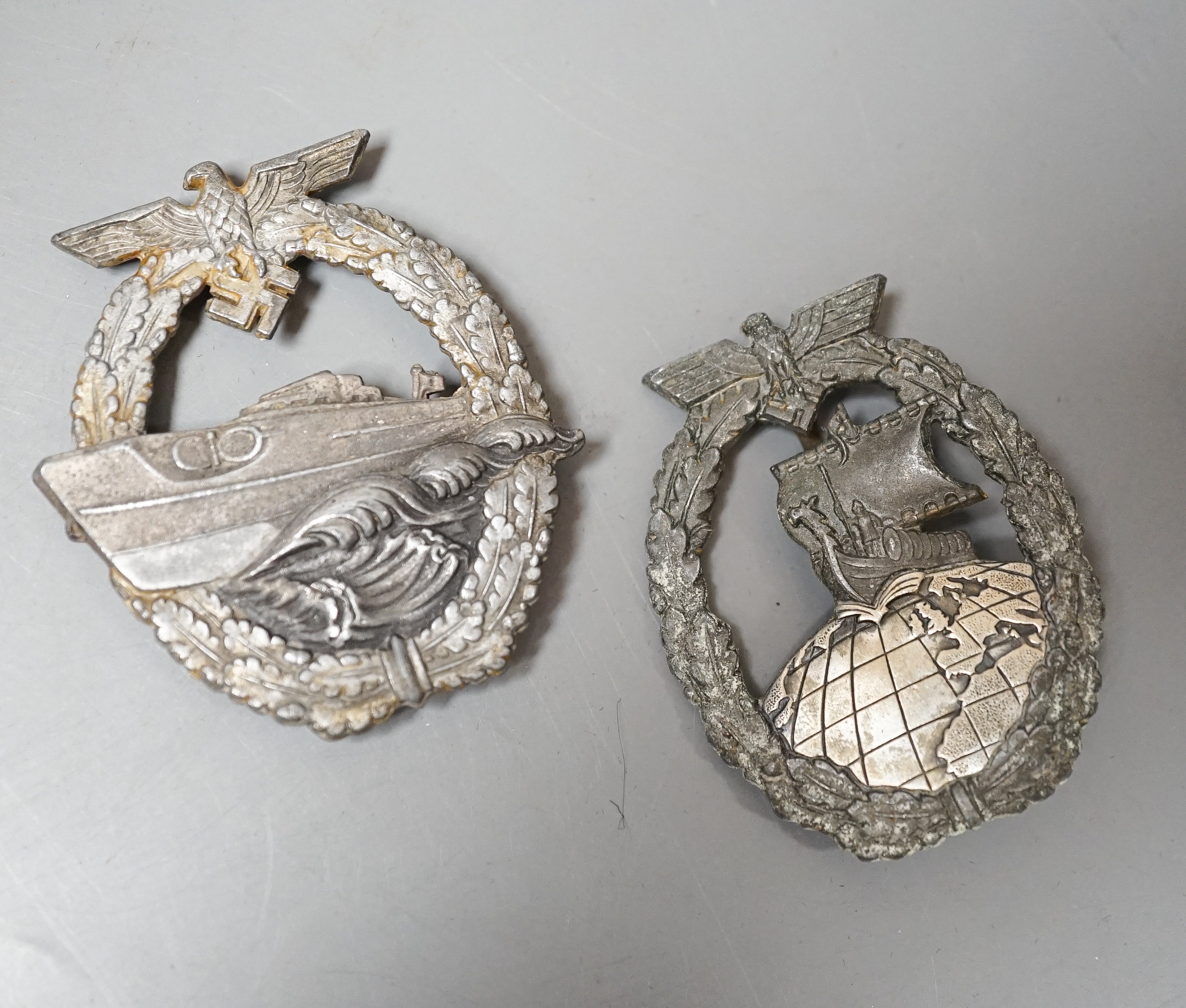 A WW2 German Kriegsmarine E-Boat Badge, marked FEC. W.E. PEEKHAUS BERLIN AUSF. SCWERN BERLIN 68 and an Auxiliary Cruiser War Badge (2)